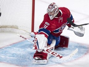 Montreal Canadiens goalie Carey Price looks back at the puck in the net on a goal by Pittsburgh Penguins&#039; Eric Fehr during second period NHL hockey action Wednesday, January 18, 2017 in Montreal.