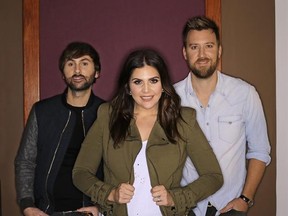 In this Jan. 9, 2017, photo, the members of Lady Antebellum, from left, Dave Haywood, Hillary Scott, and Charles Kelley pose in Nashville, Tenn. The Grammy-winning vocal group released a new single, ‚ÄúYou Look Good,‚Äù Thursday, Jan. 19, from their forthcoming album ‚ÄúHeart Break,‚Äù which comes out on June 9. (AP Photo/Mark Humphrey)