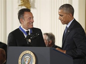 FILE - In this Nov. 22, 2016, file photo, President Barack Obama presents the Presidential Medal of Freedom to singer songwriter Bruce Springsteen during a ceremony in the East Room of the White House. Springsteen gave a private concert at the White House on Jan. 12, 2017, for longtime Obama staffers. (AP Photo/Manuel Balce Ceneta, File)