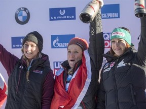 Second placed Kendall Wesenberg of the US, winner Mirela Rahneva of Canada and third placed Janine Flock of Austria, from left, celebrate after the women&#039;s skeleton World Cup in St. Moritz, Switzerland, on Friday, Jan. 20, 2017. (Urs Flueeler/Keystone via AP)