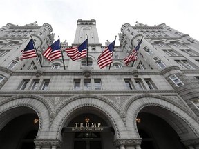 FILE - In this Dec. 21, 2106 file photo, the Trump International Hotel in Washington. An electrical subcontractor who worked on the Trump International Hotel in Washington has sued a company owned by President Donald Trump for more than $2 million, alleging it was not fully paid. (AP Photo/Alex Brandon, File)