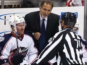 In this Oct. 8, 2016, file photo, Columbus Blue Jackets head coach John Tortorella, center, talks with linesman Brad Kovachik (71), with Scott Hartnell, left, listening during the first period of a preseason NHL hockey game against the Pittsburgh Penguins in Pittsburgh. Tortorella has returned to Ohio because of a family emergency, keeping him out of both Thursday night&#039;s game with Nashville and the NHL All-Star Game this weekend.