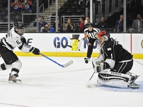 Singer Justin Bieber, left, of Team Gretzky, tries to get a shot past Team Lenieux goalie Jamie Storr during the first period of the NHL All-Star Celebrity Shootout at Staples Center, Saturday, Jan. 28, 2017, in Los Angeles. The NHL All-Star Game is scheduled to be played at Staples Center on Sunday. (AP Photo/Mark J. Terrill)