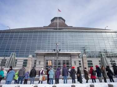 A human chain stretched along Mackenzie Avenue as an anti President Trump protest takes place at the Embassy of the United States in Ottawa.