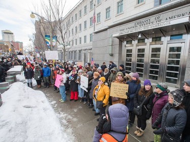 A human chain stretched along Sussex Avenue as an anti President Trump protest takes place at the Embassy of the United States in Ottawa.