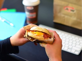An A&W English Muffin Bacon and Egger breakfast sandwich is shown in a handout photo. Two major fast-food chains in Canada say they will start serving all-day breakfast at the majority of their restaurants next month. Canadians hankering for an Egg McMuffin at night will be able to satisfy that craving starting Feb. 21, when McDonald's Canada extends its breakfast hours until close at about 1,100 of its 1,450 restaurants.