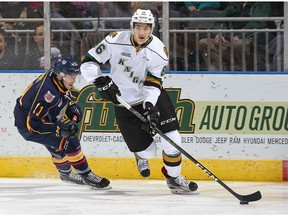 Chris Martenet #86 of the London Knights skates away from Giordano Finoro #11 of the Barrie Colts during an OHL game at Budweiser Gardens on November 25, 2016 in London, Ontario, Canada.