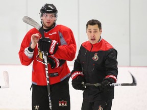 Bobby Ryan (L) of the Ottawa Senators listens to Head Coach Guy Boucher during morning practice at the Bell Sensplex in Ottawa, January 10, 2017.