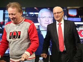 Bryan Murray was inducted in the Ring of Honour by Senators owner Eugene Melnyk (L) at Canadian Tire Centre in Ottawa, December 16, 2016.