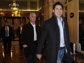 Prime Minister Justin Trudeau, right, arrives at a Liberal cabinet retreat in Calgary, Alta., Sunday, Jan. 22, 2017.THE CANADIAN PRESS/Jeff McIntosh ORG XMIT: JMC105
