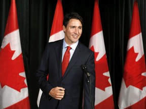 Prime Minister Justin Trudeau greets the press before going into the Liberal cabinet retreat in Calgary, Alta., Monday, Jan. 23, 2017.