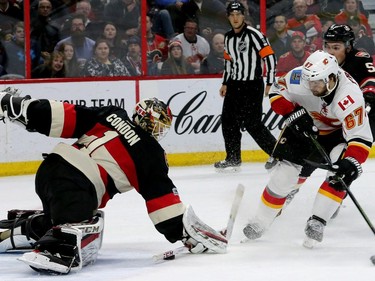 Calgary's Michael Frolic gets the puck close to Ottawa's net during second-period action between the Ottawa Senators and Calgary Flames at Canadian Tire Centre Thursday (Jan. 26, 2017). The Flames were ahead 2-0 at the end of the period. Julie Oliver/Postmedia