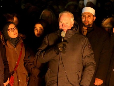 Canada's Governor General, David Johnston, speaks to the crowd during the vigil. More than 1,000 people came out to a candlelight vigil for the victims of the Quebec mosque attack Monday (Jan. 30, 2017) in front of Parliament Hill's eternal flame. Julie Oliver/Postmedia