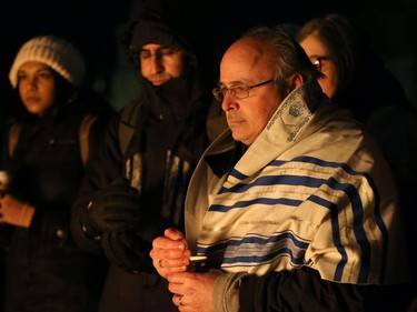 Cantor Daniel Benlolo, from the Kehillat Beth Israel Congregation in Ottawa, was amongst those at the vigil. More than 1,000 people came out to a candlelight vigil for the victims of the Quebec mosque attack Monday (Jan. 30, 2017) in front of Parliament Hill's eternal flame. Julie Oliver/Postmedia