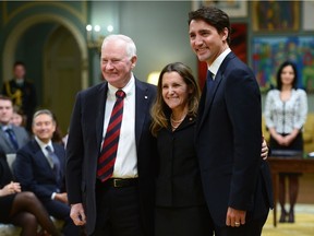 Governor General David Johnston and Prime Minister Justin Trudeau pose with Chrystia Freeland after her swearing-in as minister of foreign affairs at Rideau Hall on Jan. 10.