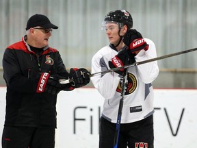 There are no guarantees that Curtis Lazar, seen talking with Senators associate coach Marc Crawford during a practice on January 10, 2017, won’t also take his turn as a healthy scratch.