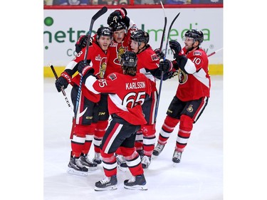 Dion Phaneuf, centre, is congratulated on his goal by Mike Hoffman, left, J-G Pageau, Tom Pyatt, right, and Erik Karlsson in the second period.