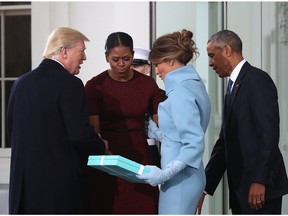 WASHINGTON, DC - JANUARY 20:  President-elect Donald Trump (L),and his wife Melania Trump (2ndR), are greeted by President Barack Obama and his wife first lady Michelle Obama, upon arriving at the White House on January 20, 2017 in Washington, DC. Later in the morning President-elect Trump will be sworn in as the nation's 45th president during an inaugural ceremony at the U.S. Capitol.