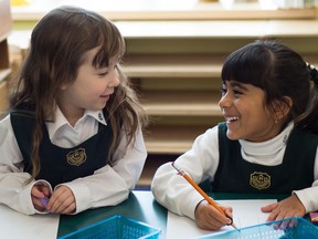 Senior Kindergarten students Avery May and Kianna Thawer discuss their plans as part of their upcoming toy making project, which is part of their current Unit of Inquiry.