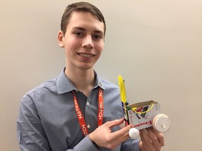 Engineering student Alexandre Légère of Royal Military College shows off the vehicle he and three teammates designed and built in six hours for an engineering contest at Carleton University.