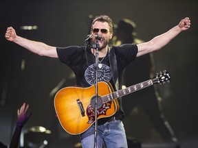 Eric Church performs with his band during The Outsiders World Tour at Rexall Place in Edmonton, Alta., on Sunday, April 12, 2015.