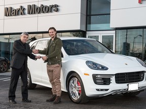 Mark Motors Porsche sales manager Manuel Pereira presents keys to Erik Karlsson, Ottawa Senators captain and new Mark Motors Porsche brand ambassador.