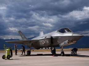 Avionic technicians and crew chiefs perform a post-operation servicing to an F-35A Lightning II assigned to the 58th Fighter Squadron at Eglin Air Force Base, Fla., while on the flightline at Peterson AFB, Colo., Sept. 30, 2016. USAF photo.