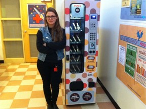 Kailin See, director of the Drug Users Resource Centre on East Cordova Street in Vancouver, stands beside a vending machine that dispenses crack pipes for 25-cents. Photo taken on Feb. 10, 2014.