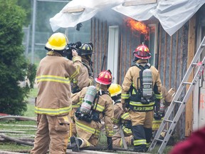 The city says it hasn't spent more money than expected on implementing a new radio system, which has been delayed. Ottawa firefighters are scheduled to come online this spring.