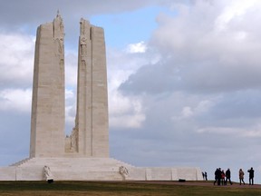 Visitors look at the memorial of the historic site of the Crete de Vimy in France.