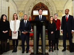 Prime Minister Justin Trudeau, middle, holds a press conference with his newly sworn-in ministers earlier this week.