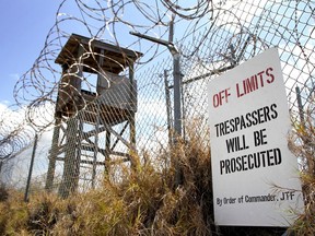 An overgrowth of bushes and weeds is what remains of Camp X-Ray today, but back in 2002, it was established as a temporary detention camp for detainees. Still standing today is a reminder of Guantanamo Bay’s past, continually serving as a historical site. (Army National Guard Photo by Sgt. Cassandra Monroe/120th PAD)