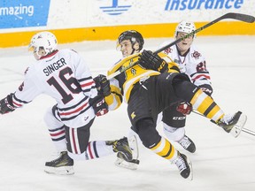 Kingston Frontenacs Zack Dorval (11) is upended after colliding with  Niagara IceDogs  Danial Singer (16) in OHL action  Saturday December 31, 2016 at the Meridian Centre in St. Catharines.