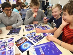 Dr. Kumanan Wilson, a senior scientist in clinical epidemiology at the Ottawa Hospital Research Institute, talks to students at Broadview Public School.