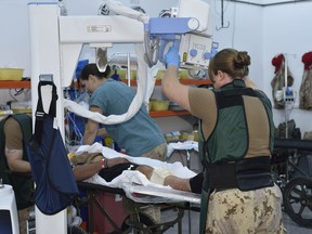 Canadian Armed Forces medical personnel X-ray a simulated patient during an exercise scenario at the Role 2 medical facility in Northern Iraq during Operation IMPACT on November 7, 2016. Photo: Op IMPACT, Canadian Forces Combat Camera IS18-2016-002-019