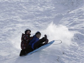 Jack Frechette, left, and a friend brace for impact on the toboggan hill at Lansdowne Park on a frigid Saturday afternoon, Jan. 7, 2017.