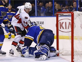 Ottawa Senators' Jean-Gabriel Pageau, second from left, scores a goal against St. Louis Blues goalie Carter Hutton during the first period of an NHL hockey game, Tuesday, Jan. 17, 2017, in St. Louis.