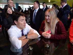 Prime Minister Justin Trudeau speaks with a student the Tim Horton's coffee shop in the Student Union Building at Bishop's University in Sherbrooke, Quebec on Wednesday January 18, 2017.