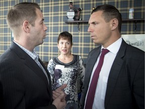 Jay Tysick, left, confronts Ontario Progressive Conservative Leader Patrick Brown during a town hall at The Glen Scottish Restaurant and Bar in Stittsville on Sunday January 29, 2017.