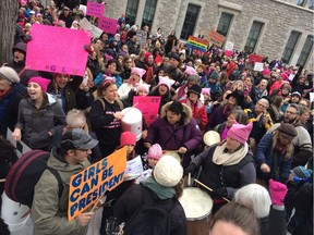 Marchers gather at the Human Rights Monument in Ottawa in support of the women's march in Washington.