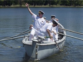Royal Canadian Navy Vice-Admiral Mark Norman waves goodbye as he is traditionally rowed away in a whaler after stepping down as the head of the Royal Canadian Navy in a ceremony Thursday, June 23, 2016 in Ottawa. Prime Minister Justin Trudeau is backing the decision by Canada's chief of the defence staff to relieve his second in command of his duties, but won't say anything more about the controversy swirling around Vice-Admiral Mark Norman.