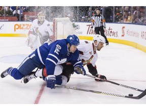 Toronto Maple Leafs left wing Matt Martin, left, vies for the puck with Ottawa Senators defenceman Marc Methot during second period NHL hockey action, in Toronto on Saturday, January 21, 2017.