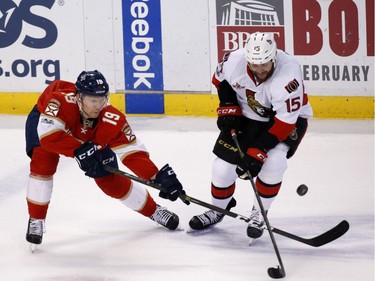 Florida Panthers defenseman Michael Matheson (19) and Ottawa Senators center Zack Smith (15) vie for the puck during the second period of an NHL hockey game, Tuesday, Jan. 31, 2017, in Sunrise, Fla.