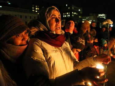 More than 1,000 people came out to a candlelight vigil for the victims of the Quebec mosque attack Monday (Jan. 30, 2017) in front of Parliament Hill's eternal flame. Julie Oliver/Postmedia