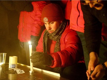 More than 1,000 people came out to a candlelight vigil for the victims of the Quebec mosque attack Monday (Jan. 30, 2017) in front of Parliament Hill's eternal flame. Julie Oliver/Postmedia