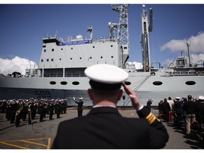 Naval officers are seen at CFB Esquimalt for HMCS Protecteur's paying-off ceremony in Esquimalt, B.C., Thursday May 14, 2015.