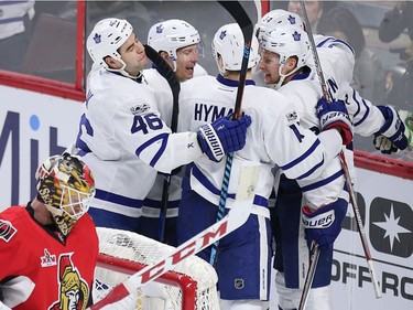 Ottawa goalie Mike Condon bows his head while the Leafs celebrate their fourth goal of the game in the third period on Saturday, Jan. 14, 2017 at the Canadian Tire Centre.