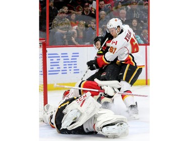 Ottawa newcomer Tommy Wingels battles Calgary's Brett Kulak in front of Brian Elliot's net during first-period action between the Ottawa Senators and Calgary Flames at Canadian Tire Centre Thursday (Jan. 26, 2017). Julie Oliver/Postmedia
