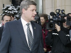 Stephen Harper walks past journalists in 2006 outside the National Press Theatre, one of his few appearances in that venue.