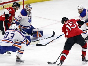 Ottawa Senators forward Zack Smith (15) gets ready to shoot and score on Edmonton Oilers goaltender Jonas Gustavsson as teammate Derick Brassard looks on during the first period at the Canadian Tire Centre on Sunday, Jan. 8, 2017.